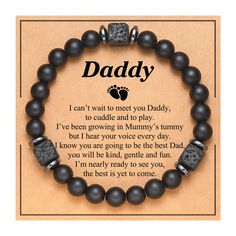 a black beaded bracelet with the words daddy written on it and an image of a dog