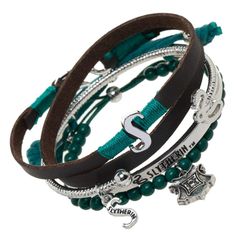 three different bracelets with charms and beads on each one side, including the letter s