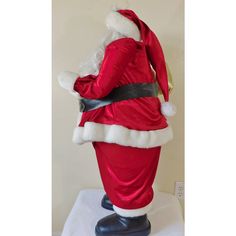 a santa claus costume on display in a room