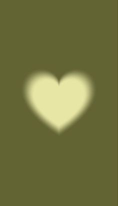 the shadow of a heart on a green background