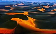 an aerial view of sand dunes in the desert