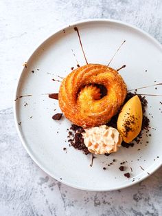 a white plate topped with desserts on top of a table