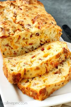 slices of cheesy bread sitting on top of a white plate