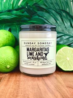 "MARGARITA scent: a fruity and bright blend of lime, sea salt and orange with notes of guava, agave, sugar and tequila. A summer vacation in a jar! Label: \"MARGARITAS, LIME & SUNSHINE\" MISPRINT NOTICE: all candles in the Margarita series are discounted due to a tiny misprint on the labels. ---------------- Approximate size and details:  Volume: 8 oz  Glass jar with metal lid: 2.90 x 3.5 inches Wax: natural coconut and soy Wick: cotton or wood Strength: DOUBLE scented Other attributes: vegan, phthalate-free, paraffin-free * 8 oz single-wick candles work great in smaller spaces and rooms. ----------------   Single wick: choice of cotton or wood - cotton wicks: made from natural organic cotton woven with paper for a more complete burn, eco-friendly, soy wax coating, lead free, zinc free, no Island Margarita Candle, Tropical Margarita, Bright Blend, Spiced Eggnog, Summer Candle, Wet Spot, Summer Candles, Jar Labels, In A Jar