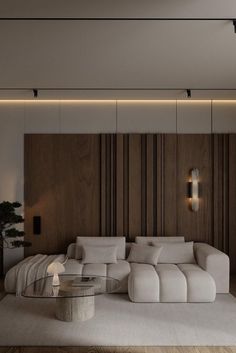 a modern living room with white furniture and wood paneling