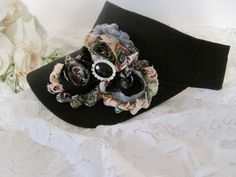 I designed this adorable black visor with beautiful matching variegated shabby flowers. I added a beautiful black and rhinestone center accent. Visor has velcro back I also have more colors that I will be listing as well. See more hats and visor here: https://www.etsy.com/shop/theraggedyrose?ref=seller-platform-mcnav&section_id=10557807 Custom orders alway welcome. Thanks for visiting my shop. Golf Visor, Hats Summer, Summer Hats For Women, Shabby Flowers, Golf Hats, Visor Hats, Women's Hats, Sun Visor, Colorado Springs