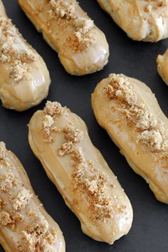 glazed donuts are lined up on a baking sheet and ready to be baked in the oven