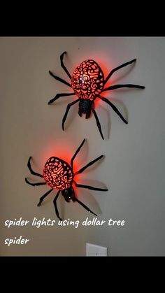 two spider lights sitting next to each other