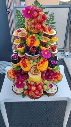 there is a very large display of fruit on the table