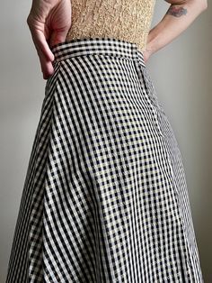 Get the party started. Vintage 90s High Waist Gingham A Line Maxi Skirt in Black, Off White and Gold. Size 7/8. Fits S/M best. Please refer to measurements below. Acetate & Lurex Blend. Zipper in back for closure. Condition is Pristine.  The colors of the photographs may differ slightly from the actual item colors. Measurements were taken with item laying flat, and are approximate. Waist: 13.5" Length: 42" Please message questions prior to purchase- I'm happy to help. Once shipped, sales are final, no return/exchange. But please contact me if you have any problems with your order. Thanks! Shown on a 5'8" 34B. Summer Plaid Flared Skirt, Spring Gingham Skirt In Preppy Style, Preppy Gingham Skirt For Spring, Spring Gingham Gathered Skirt, Plaid Gathered Skirt For Summer, Summer Preppy Plaid Skirt, Preppy Plaid Summer Skirt, Fitted Gingham Lined Skirt, Fitted Gingham Skirt With Lining