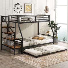 a black bunk bed with stairs next to a window and potted plant on the floor