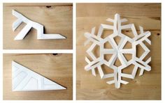 four different snowflakes are shown on a wooden surface, one is white and the other has an ornament