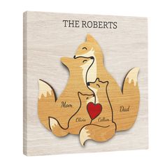 a wooden puzzle with two cats and a heart on the front, which reads'the robertss '