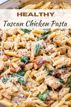 chicken pasta with spinach and parmesan cheese in a skillet