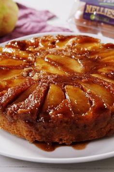 a white plate topped with a pineapple upside down cake next to a bag of nutella