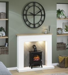 a fireplace with a clock on the wall above it