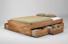 a bed with two drawers underneath it