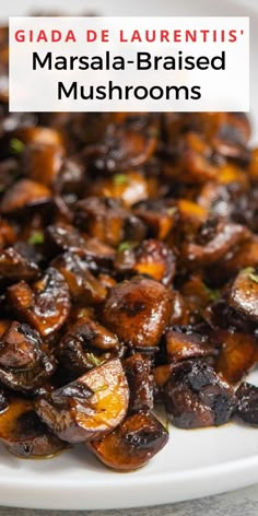 grilled mushrooms on a white plate with text overlay that reads, galade laurentis masala - braised mushrooms