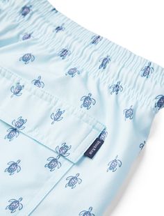 Make a splash with our Light Blue Turtle Print Swimshorts, a must-have for any beach or pool day. Crafted from a blend of 86% Polyester and 14% Elastane, these swimshorts are the epitome of comfort and durability. The fabric's 4-way stretch ensures a perfect fit that moves with you, while its quick-dry capabilities mean you won't stay wet for long after a dip. Adorned with a charming light blue turtle print, these shorts are not only functional but also stylish, designed to resist fading even un Blue Short-length Swimwear For Poolside, Beachy Swim Trunks For Summer Poolside, Beachy Swim Trunks For Poolside Summer, Beachy Swim Trunks For Poolside In Summer, Blue Swimwear With Built-in Shorts For Vacation, Bermuda Style Swim Trunks For Summer, Summer Swim Trunks For Vacation Pool, Summer Vacation Swim Trunks For Pool, Casual Cotton Swim Trunks For Beach