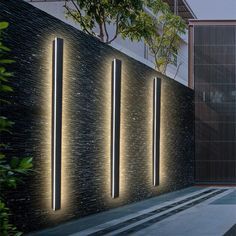 an outdoor area with several lights on the wall