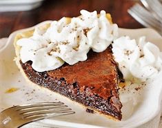 a slice of chocolate pie with whipped cream on top