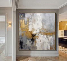 an abstract painting hangs in the middle of a room