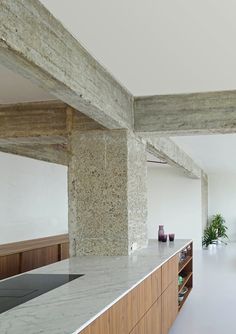 the kitchen counter is clean and ready to be used as a dining room or office