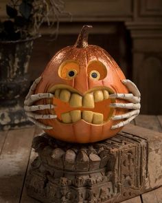 a carved pumpkin with teeth and fangs on it