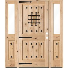 the front door is made from wood and has metal bars on it, as well as two