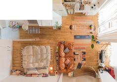 an overhead view of a living room and kitchen