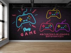 neon video game controllers are displayed on the wall