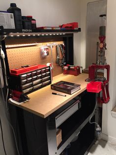 a workbench with tools on it in a garage