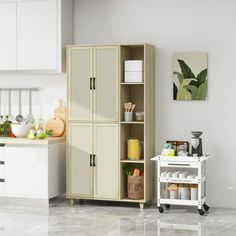 a kitchen with white cabinets and marble flooring