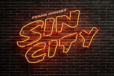 a neon sign on the side of a brick wall that says, frank miller's sunny city