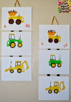 two pictures of construction vehicles are on the wall next to each other, and one is made out of paper