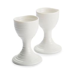 two white vases sitting side by side on a white surface, one is shaped like an egg