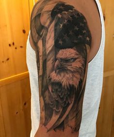 an eagle with the american flag on his arm and chest is shown in this image