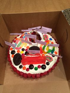 a decorated birthday cake sitting in a box