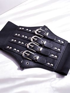 Enhance your edgy and gothic look with this black gothic punk corset belt. Crafted with high-quality materials, this corset belt features a sleek black design with punk-inspired details. Perfect for adding a bold and striking accent to any outfit, this versatile accessory can be paired with a variety of tops and dresses.  Please note that this product includes only the corset belt.  Garment Size   	 		 			Size 			Free Size 		 		 			Width 			12-19 		 		 			Waist 			68-80 Black Punk Corset For Alternative Fashion, Black Edgy Corset For Concert, Black Gothic Corset For Club Wear, Gothic Black Corset For Club, Black Gothic Corset For Club, Edgy Black Belt Buckle With Removable Belt, Black Party Corset With Belt, Gothic Black Corset Belt With Belt Included, Black Steampunk Corset Belt For Alternative Fashion