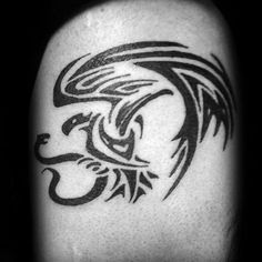 a black and white photo of an eagle tattoo