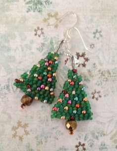 green beaded christmas tree earrings with bells