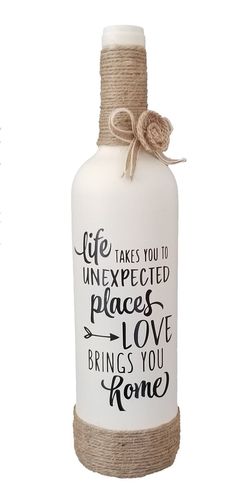 a white bottle with a rope wrapped around it and the words life takes you to unexpected places love brings you home