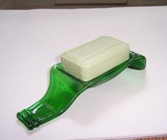 a green toothbrush sitting on top of a white table