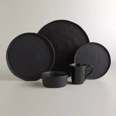 black dinnerware set with two cups and one plate