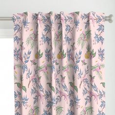 a pink curtain with blue and green leaves on it