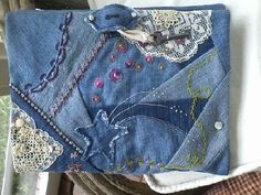 an old pair of jeans has been decorated with lace and sequins on it