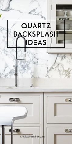 a white kitchen with marble backsplash and stainless steel sink faucet in the center