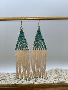 "Beautiful handmade beaded earrings. Made with Miyuki delica beads. They are 4\" long and 1\" wide.  14k gold plated ear wire" Unique Turquoise Beaded Earrings, Turquoise Bohemian Beaded Single Earring, Delica Dangle Earrings, Green Handwoven Beaded Dangle Earrings, Bohemian Turquoise Beaded Brass Earrings, Handmade Earrings Beaded, Delica Beads, Beaded Dangle Earrings, Ear Wire