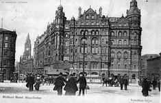 an old black and white photo of people walking in front of a building with tall towers