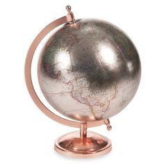 a silver and gold globe on a stand with a rose gold ring around the base